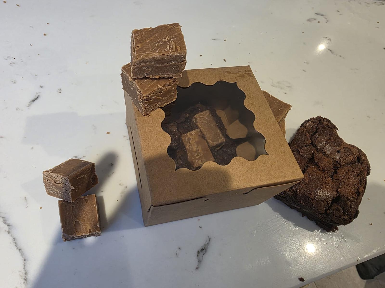 Ted’s brownies in a brown bakery box, with separately sold fudge alongside